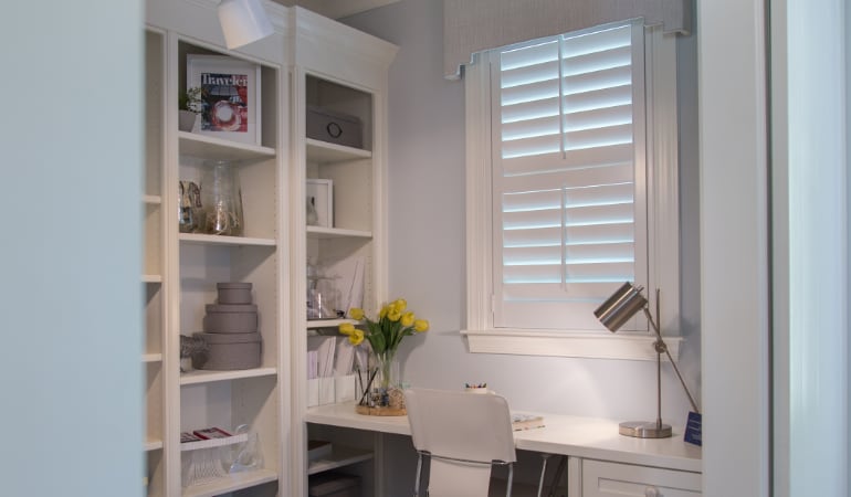 Home office with polywood shutters.